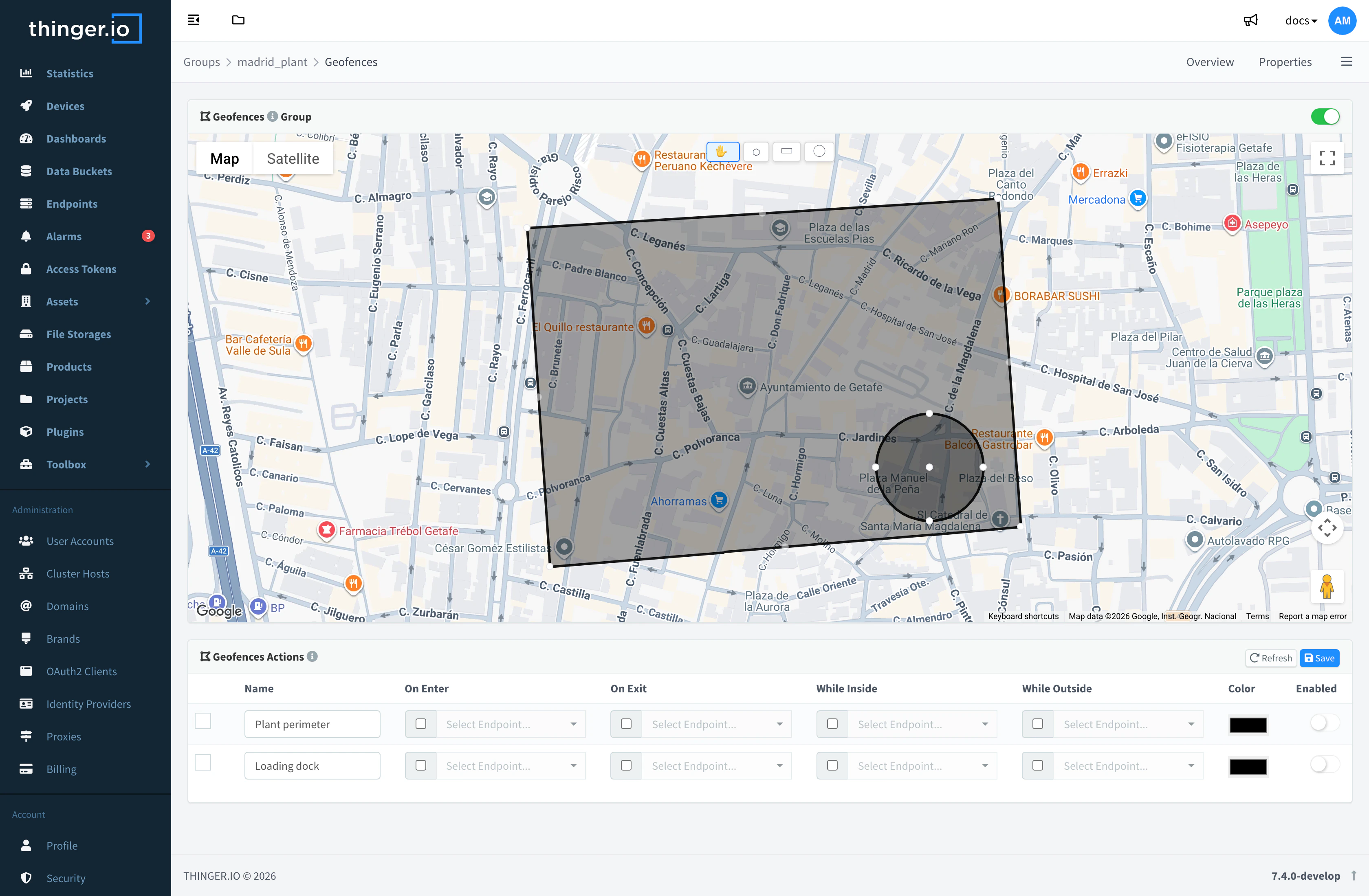 Geofences tab of an asset group in edit mode, with the drawing buttons, a polygon and a circle on the map and the actions table